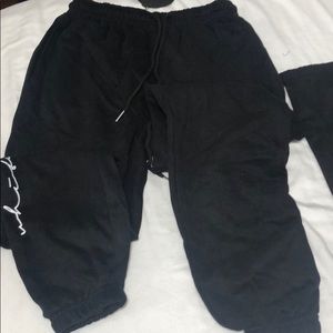 Black sweatpants, with white lettering, never worn